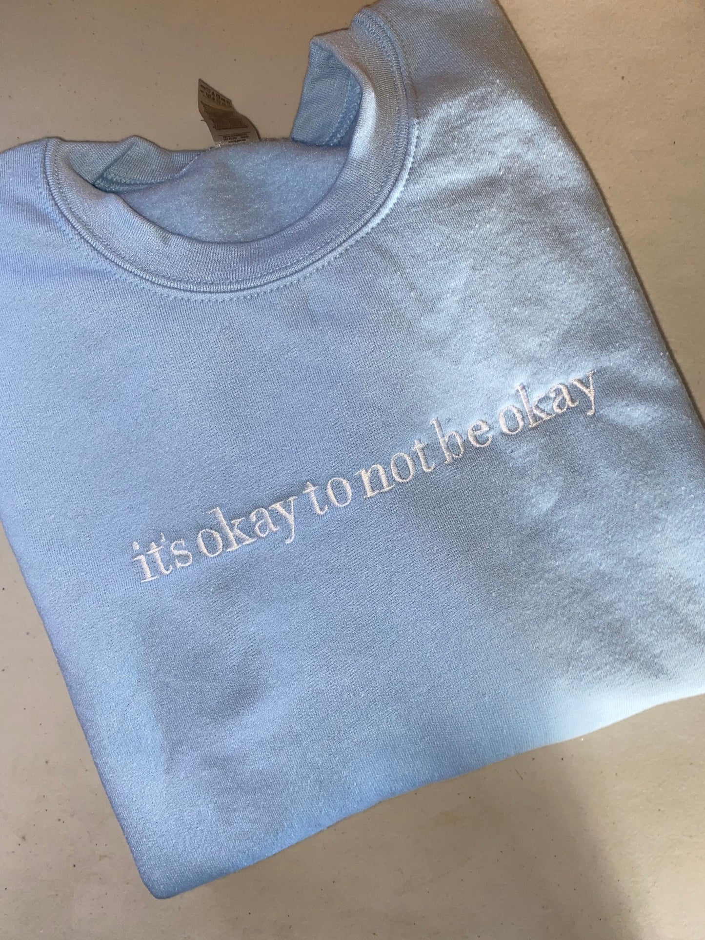 It’s okay to not be okay embroidered sweatshirt